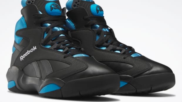 View of black and blue Reebok shoes.